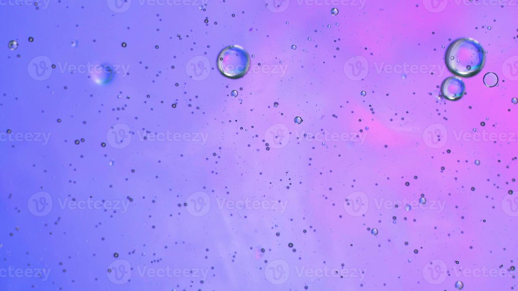 Abstract pink, purple colorful background with oil on water surface. Oil drops in water abstract psychedelic, abstract image. photo
