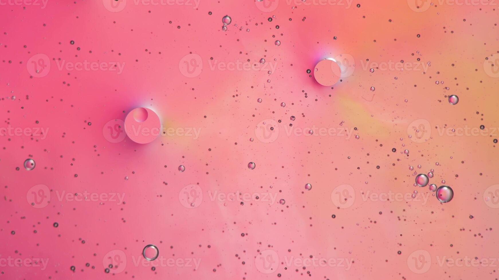 Abstract pink colorful background with oil on water surface. Oil drops in water abstract psychedelic, abstract image. photo