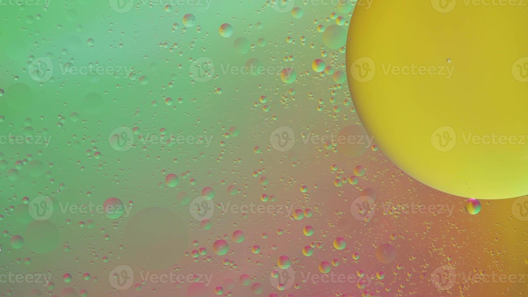 Abstract yellow and green colorful background with oil on water surface. Oil drops in water abstract psychedelic, abstract image. photo