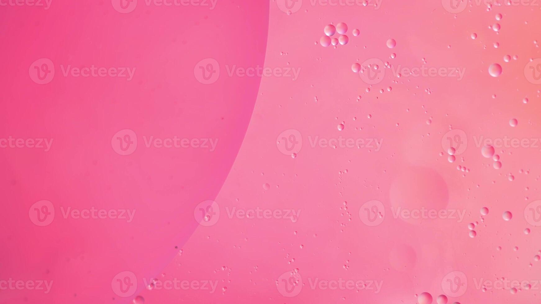 Abstract pink colorful background with oil on water surface. Oil drops in water abstract psychedelic, abstract image. photo