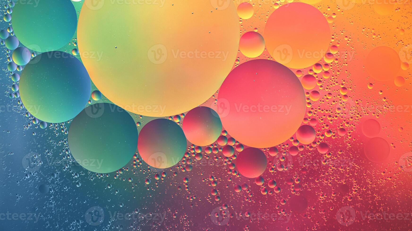 Abstract yellow, green, pink and blue colorful background with oil on water surface. Oil drops in water abstract psychedelic, abstract image. photo