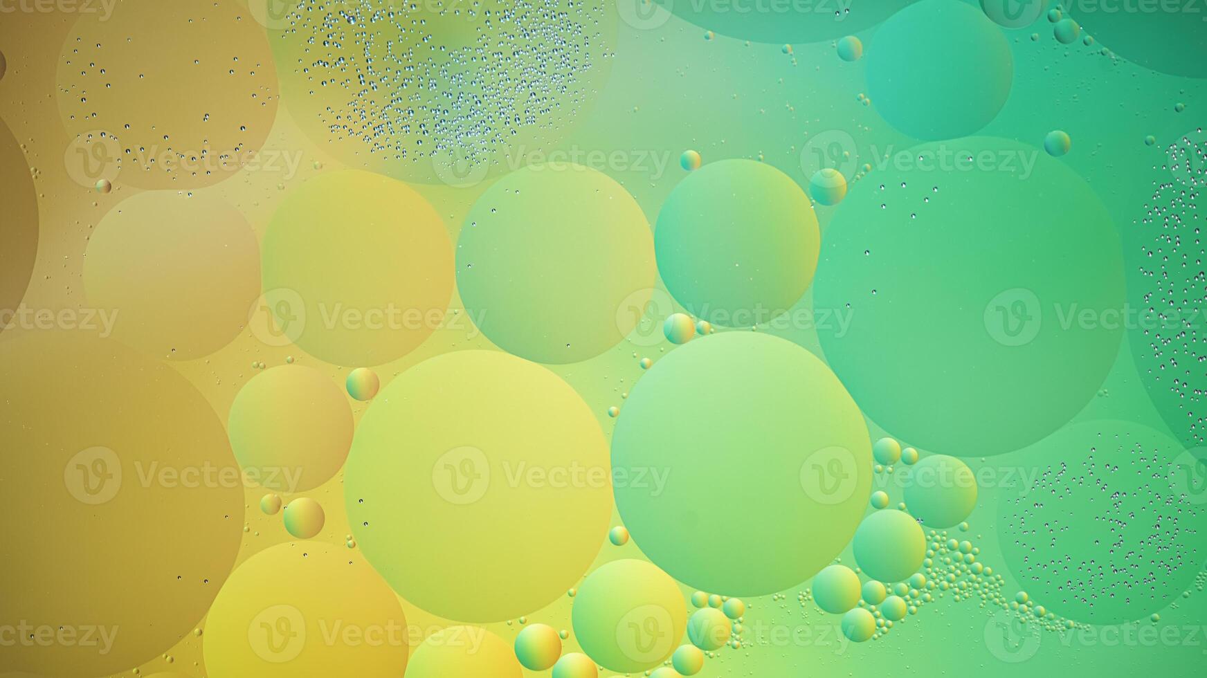 Abstract yellow and green colorful background with oil on water surface. Oil drops in water abstract psychedelic, abstract image. photo