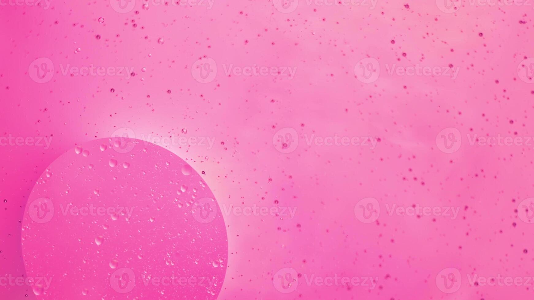 Abstract pink colorful background with oil on water surface. Oil drops in water abstract psychedelic, abstract image. photo