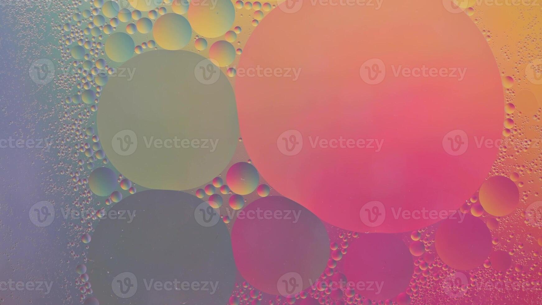 Abstract yellow, green and pink colorful background with oil on water surface. Oil drops in water abstract psychedelic, abstract image. photo