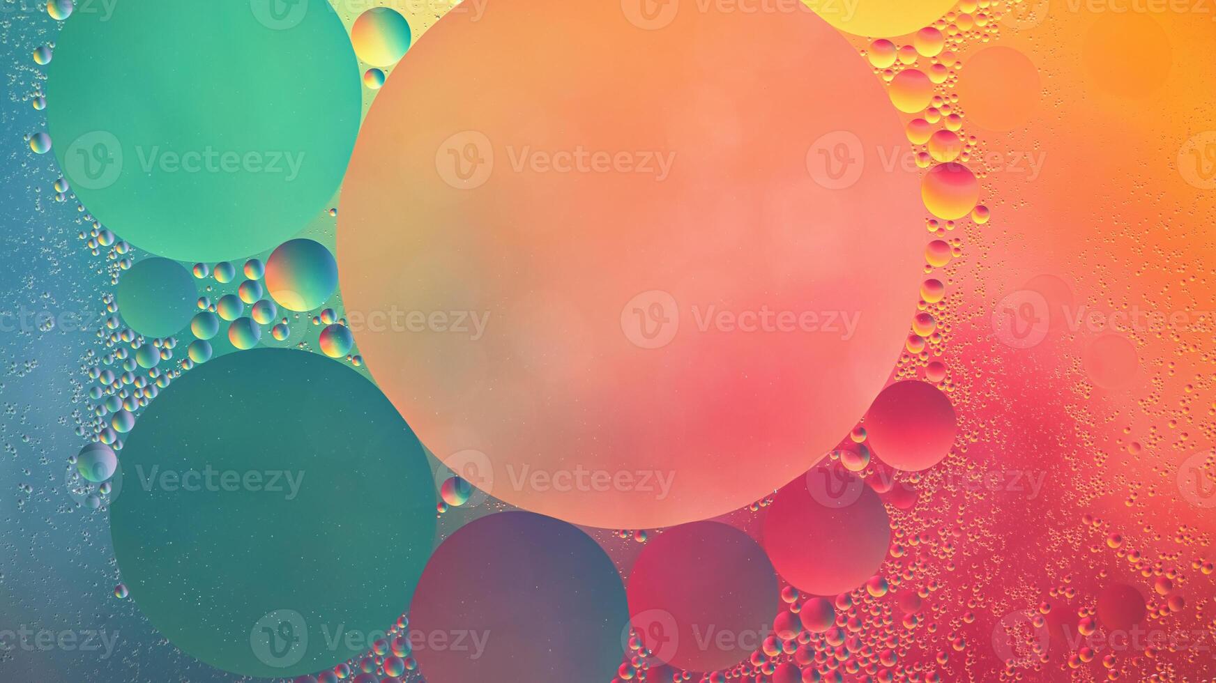 Abstract yellow, green and pink colorful background with oil on water surface. Oil drops in water abstract psychedelic, abstract image. photo