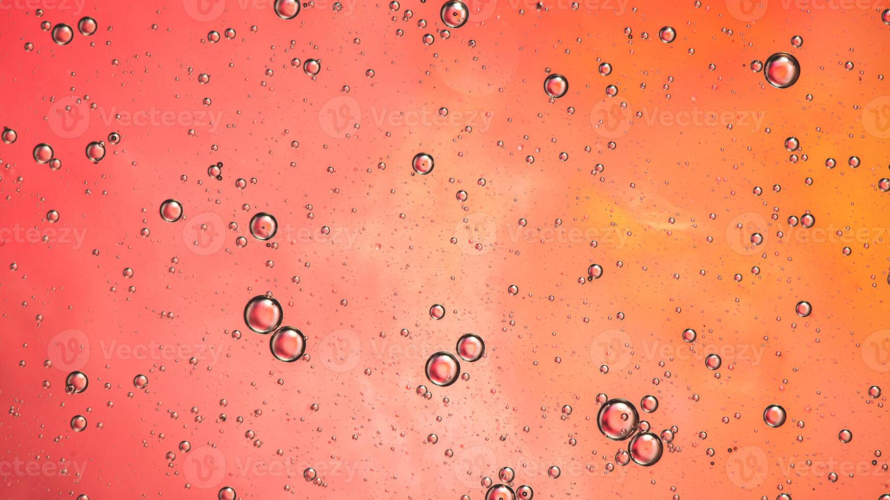 Abstract pink colorful background with oil on water surface. Oil drops in water abstract psychedelic, abstract image. photo