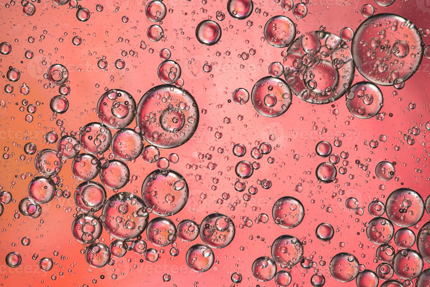 Abstract pink colorful background with oil on water surface. Oil drops in water abstract psychedelic, abstract image. photo