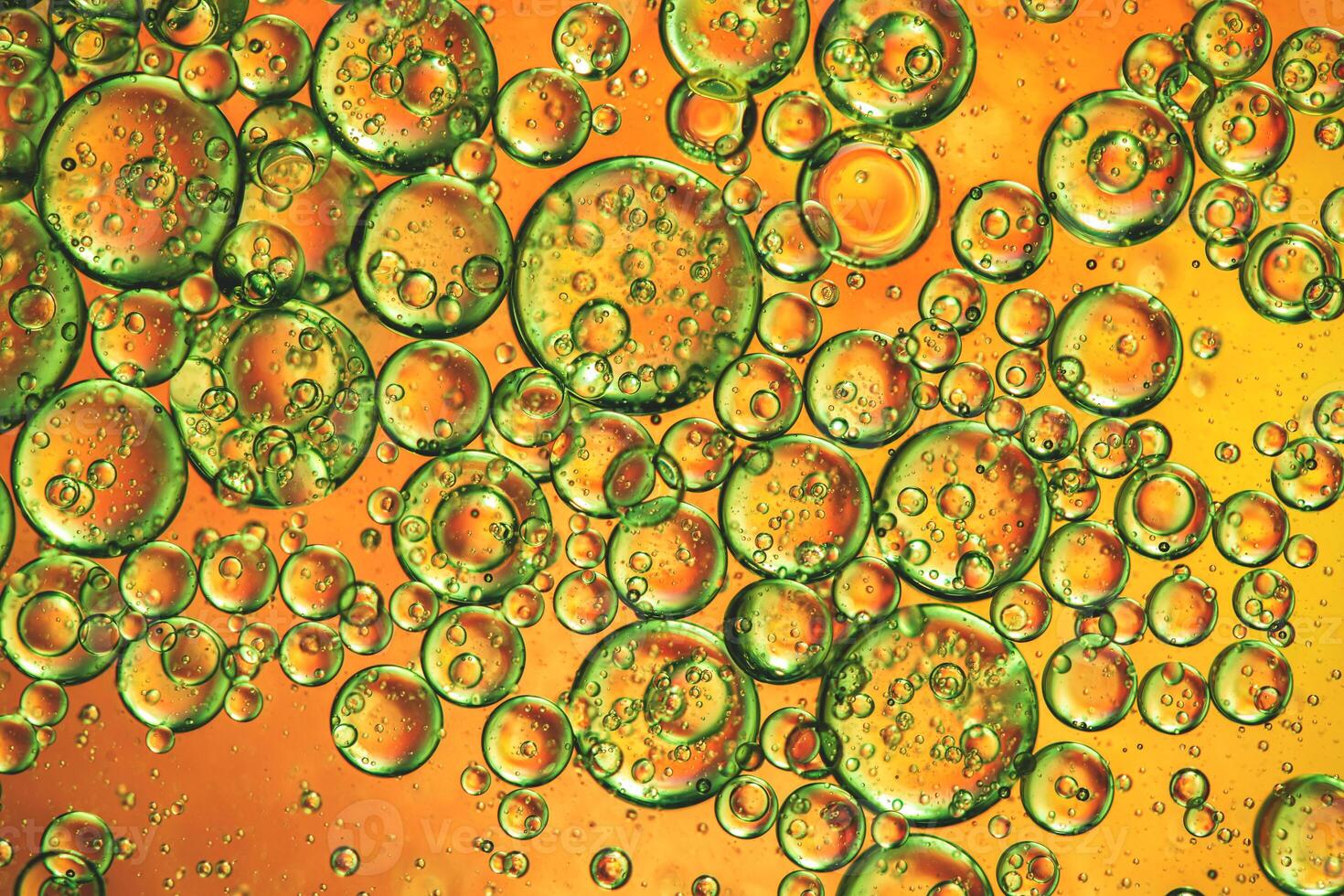Abstract orange colorful background with oil on water surface. Oil drops in water abstract psychedelic, abstract image. photo