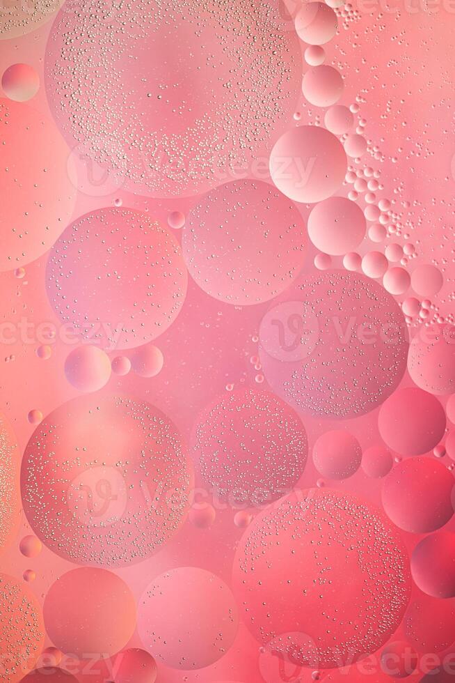 Abstract pink colorful background with oil on water surface. Oil drops in water abstract psychedelic, abstract image. photo