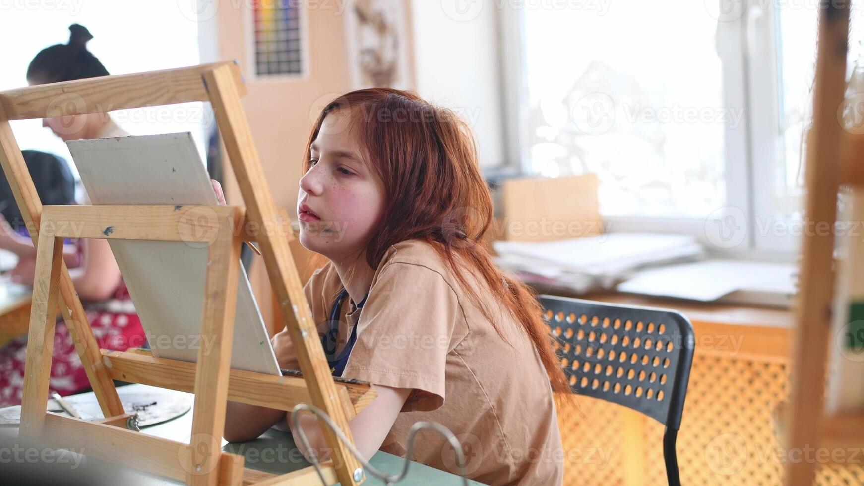 Cute girl in art studio painting oil painting. Hobbies, Relaxation, Art Therapy photo