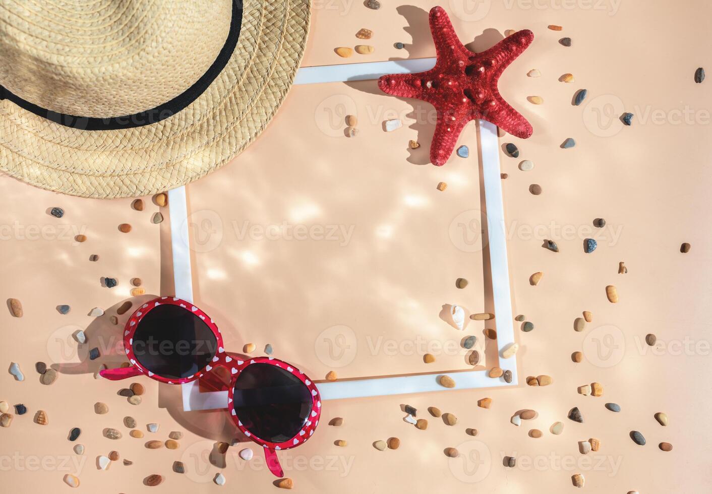 summer flat lay. sea, travel. hat, starfish, shell and white frame. photo