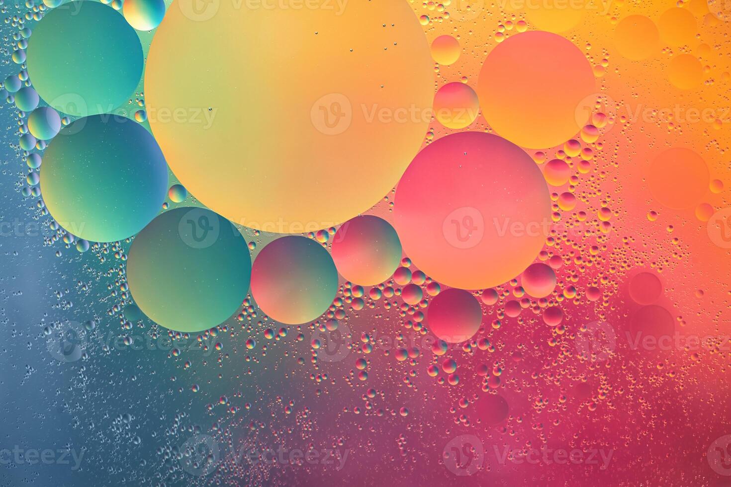 Abstract yellow, green, pink and blue colorful background with oil on water surface. Oil drops in water abstract psychedelic, abstract image. photo