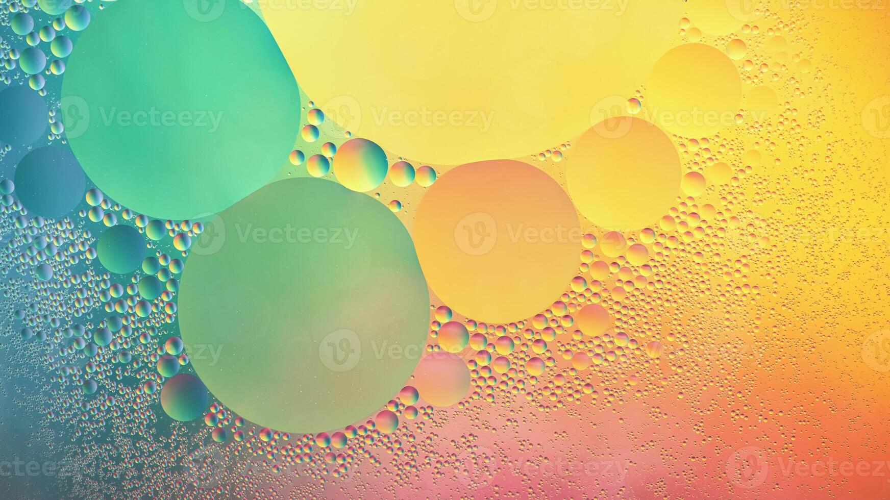 Abstract yellow, green and pink colorful background with oil on water surface. Oil drops in water abstract psychedelic, abstract image. photo