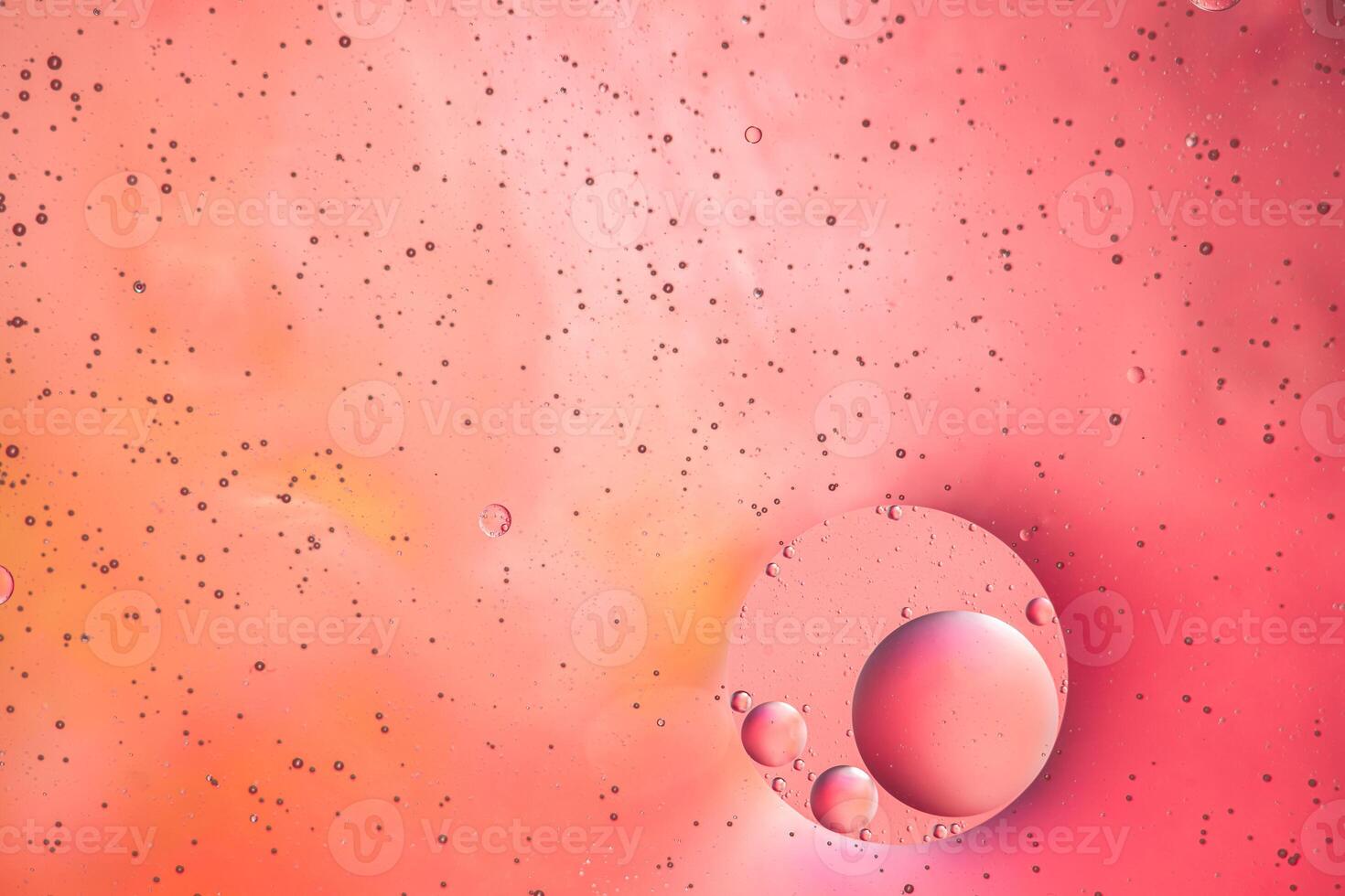 Abstract pink colorful background with oil on water surface. Oil drops in water abstract psychedelic, abstract image. photo