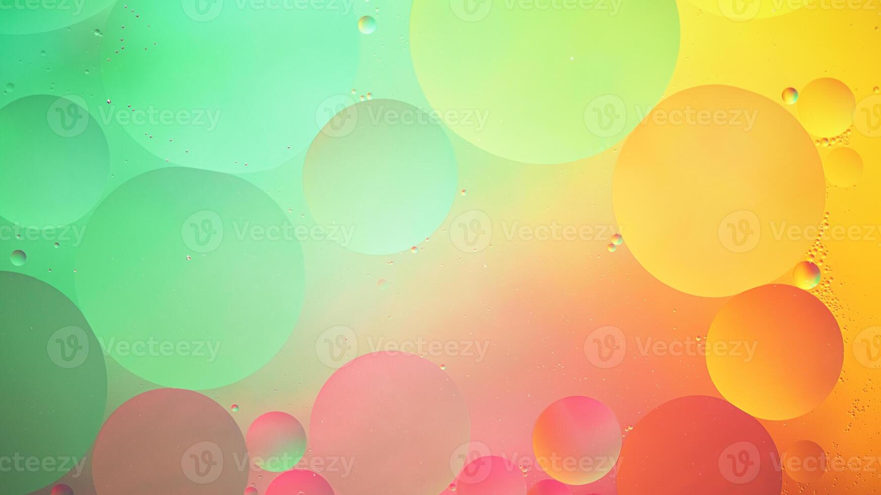 Abstract yellow, green and pink colorful background with oil on water surface. Oil drops in water abstract psychedelic, abstract image. photo