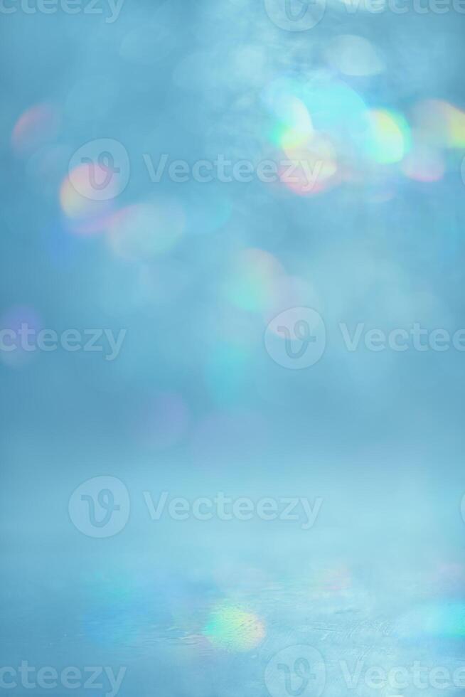 abstract light, blue background with multi-colored, rainbow highlights and bokeh photo