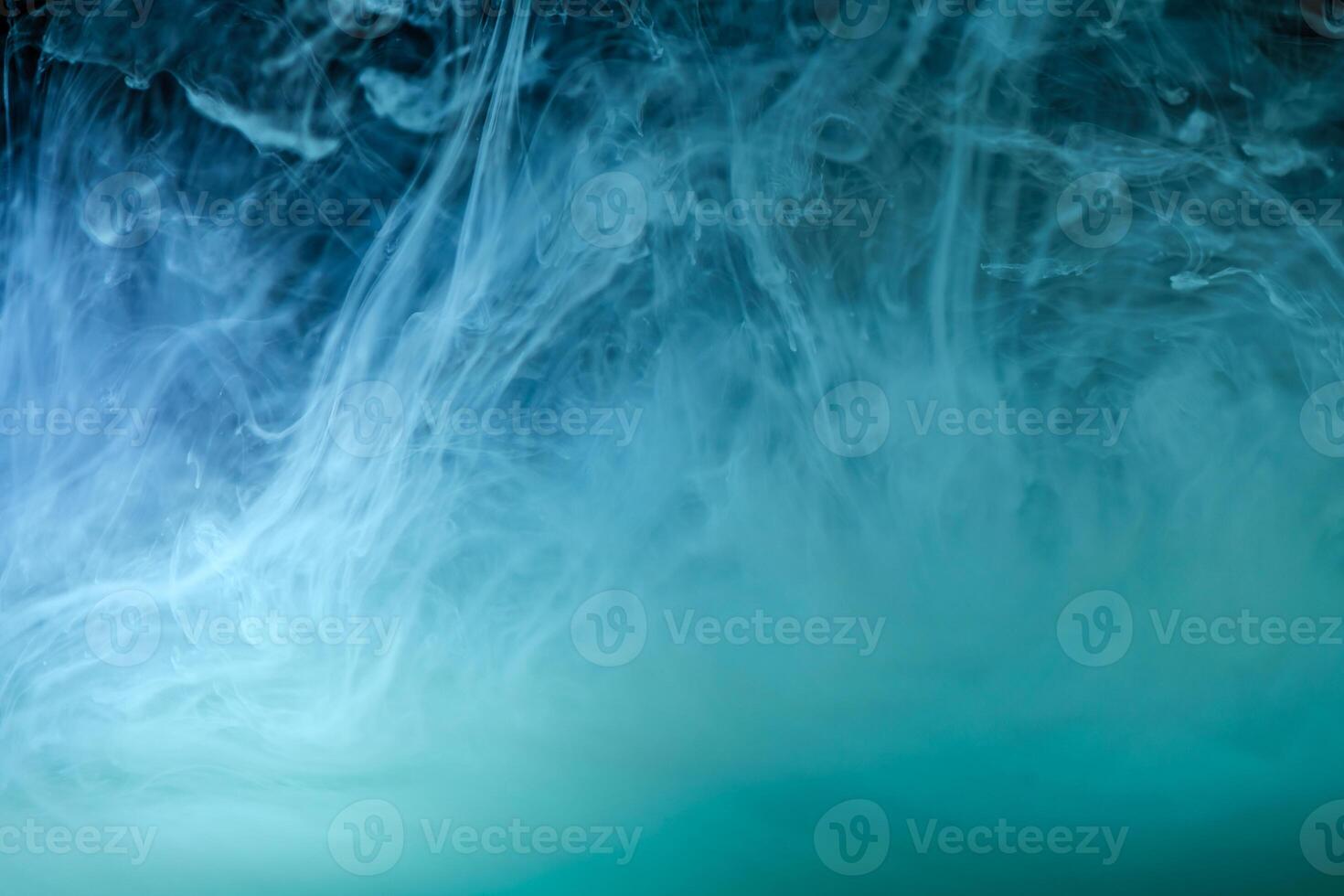 clouds of blue smoke on a black background, clouds of paint in water, aquarium, abstract background, texture photo