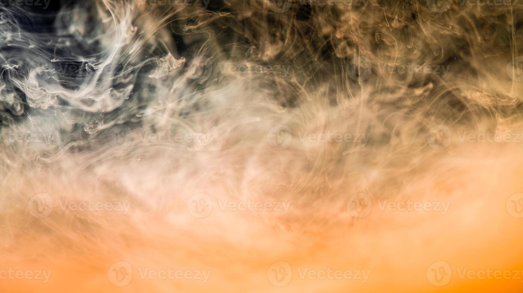 clouds of peach fuzz smoke on a black background, clouds of paint in water, aquarium, abstract background, texture photo