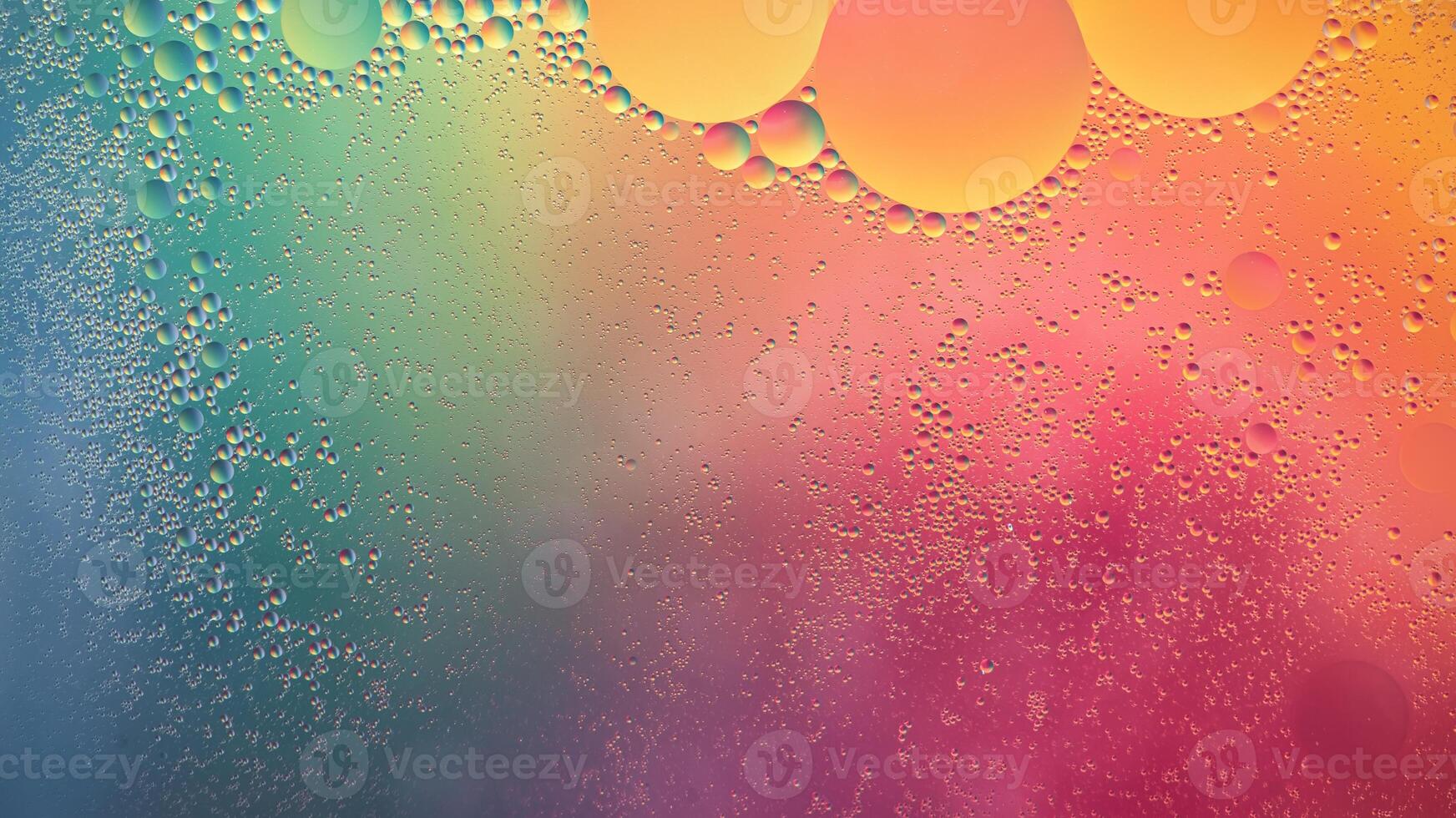 Abstract yellow, green and pink colorful background with oil on water surface. Oil drops in water abstract psychedelic, abstract image. photo
