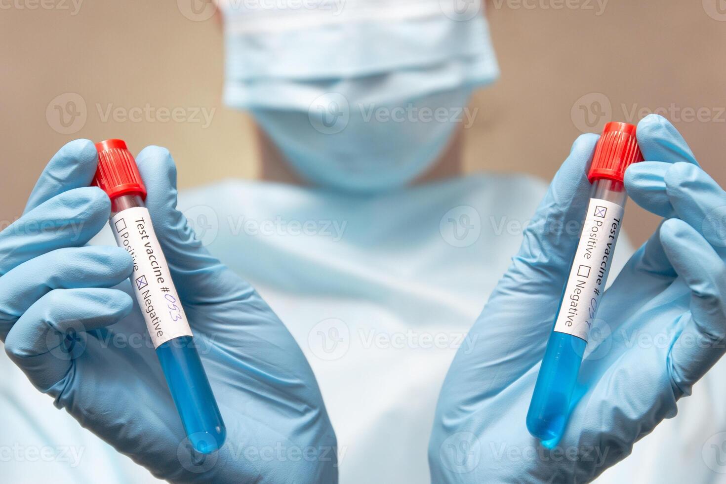 Coronavirus vaccine, positive and negative. Doctor in protective suit, medical mask and latex gloves holds a test tubes with vaccine. photo