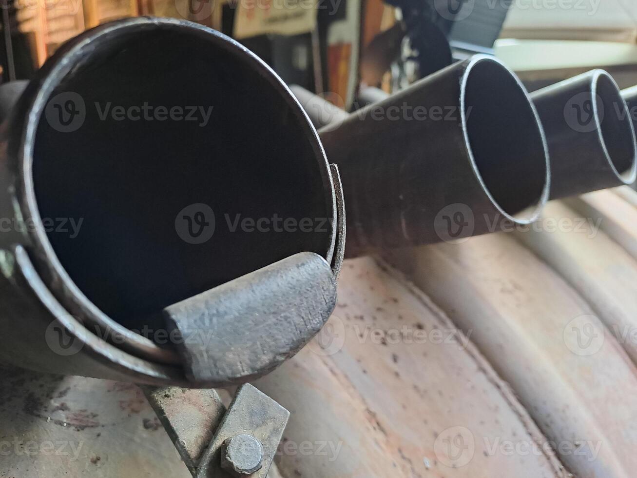 Antique Iron pipes from a fireplace or stove, close-up photo