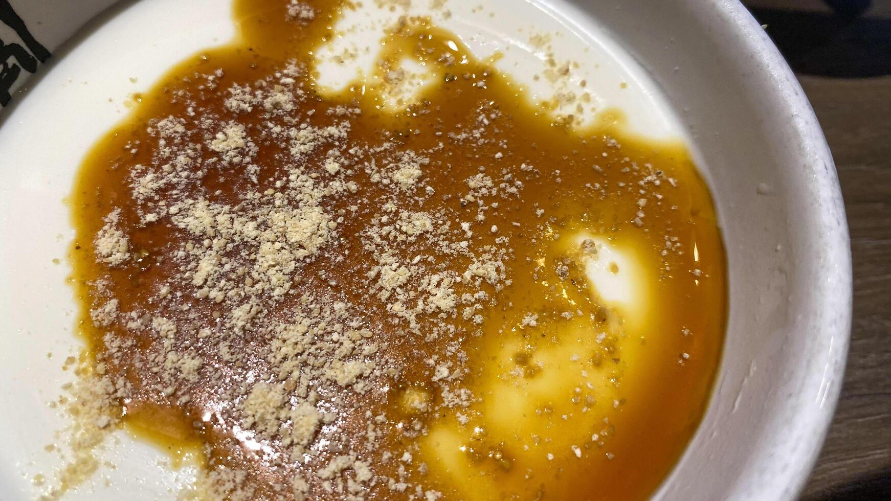 there is a bowl of food with a mixture of brown liquid photo