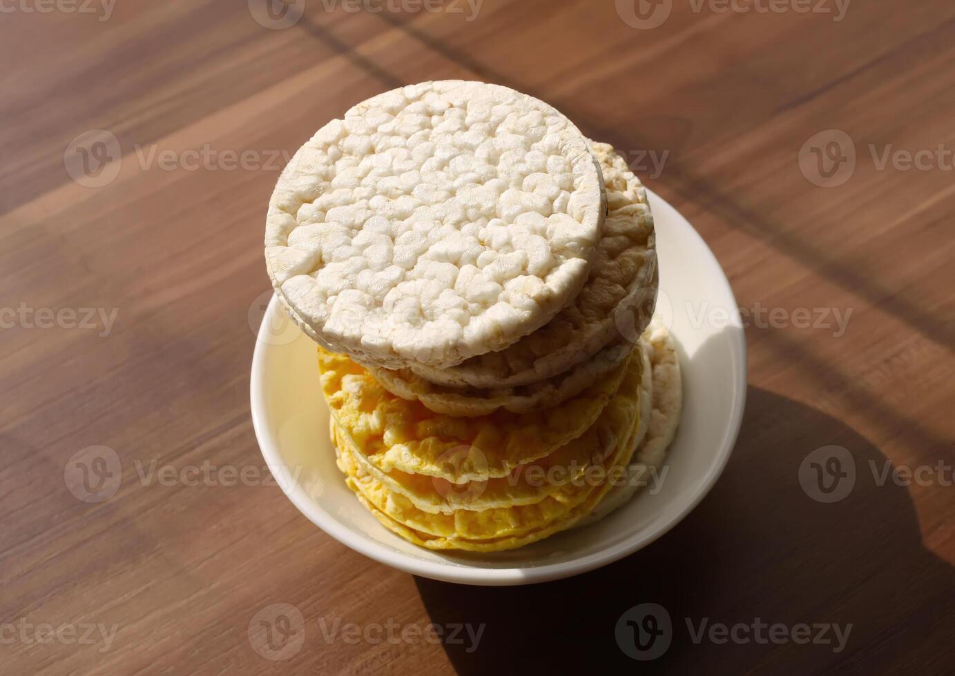 White rice crackers on blue background. photo