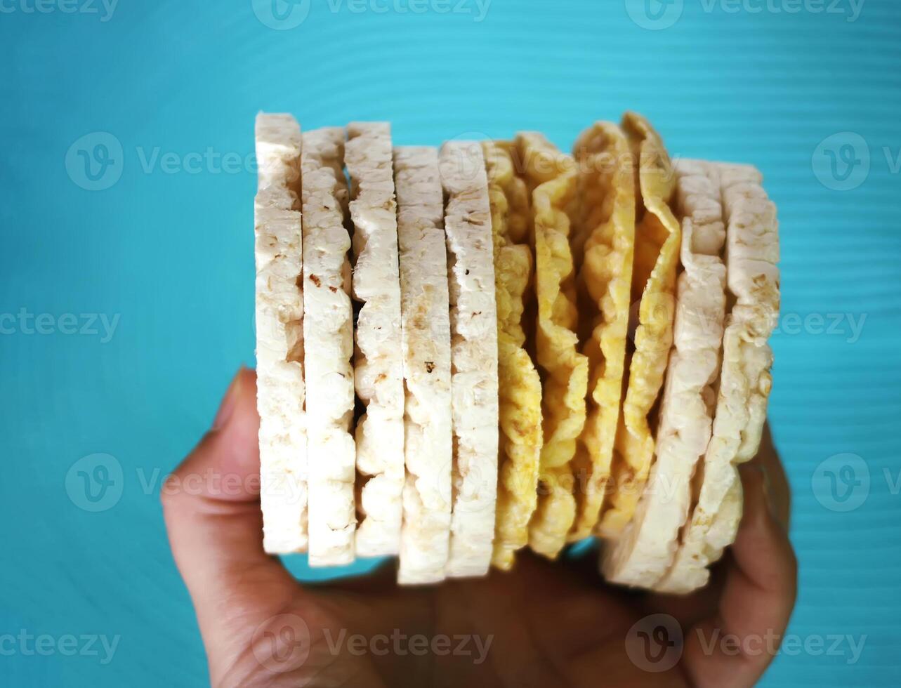 White rice crackers on blue background. photo