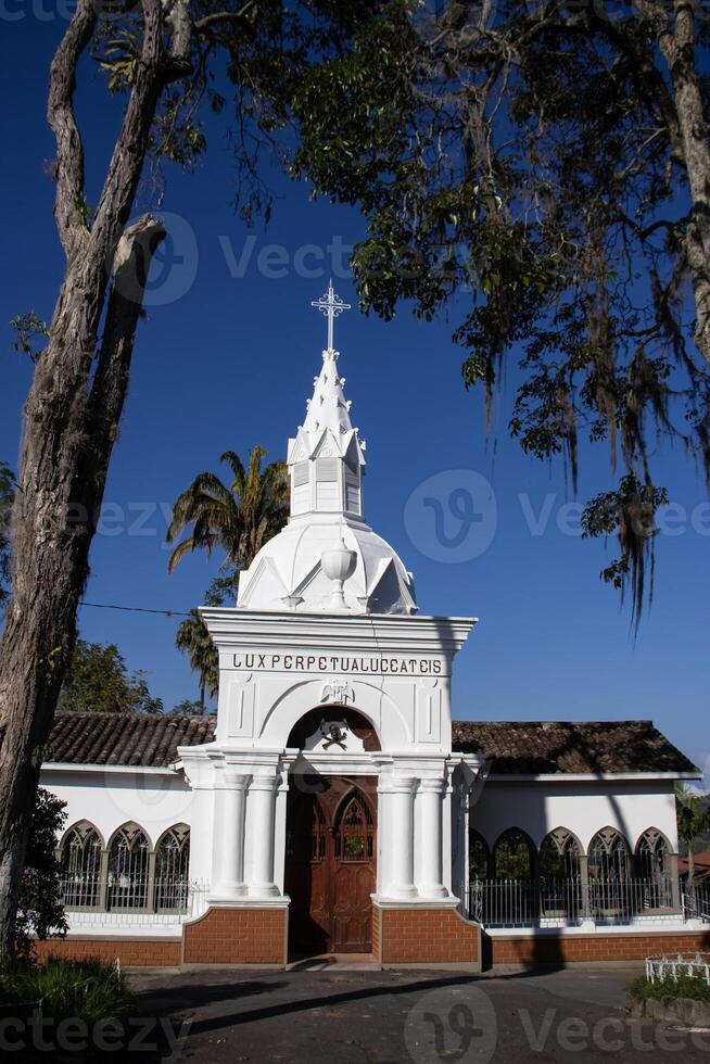 Cemetery of Our Lady of La Valvanera built in 1903 at the beautiful heritage town of Salamina in the department of Caldas in Colombia. Text says May perpetual light shine upon them. photo
