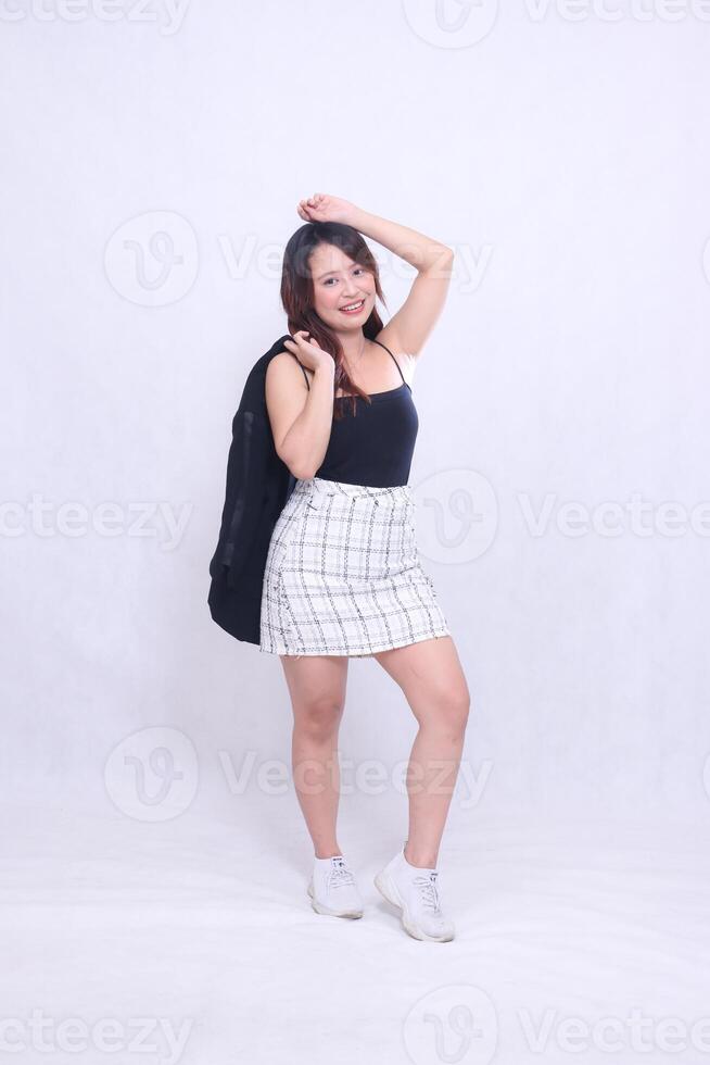 full body asian woman 20s office girl sexy smile holding jacket to hands and top hair isolated white background photo