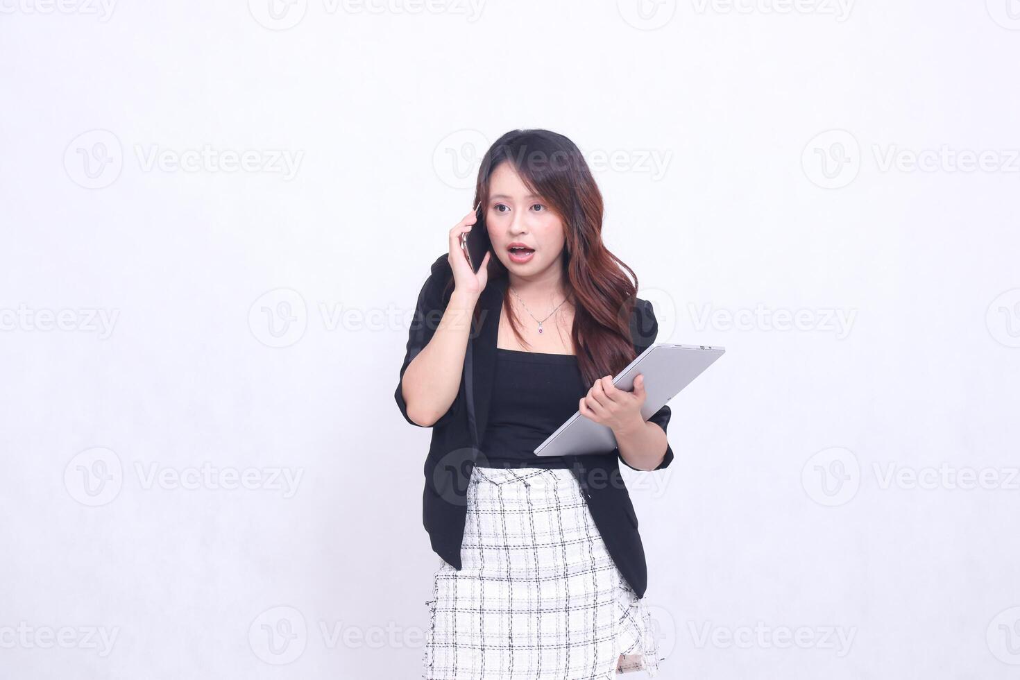 beautiful southeast asian girl 20s formal office shocked is calling her friend and bringing tablet for promo isolated white background photo