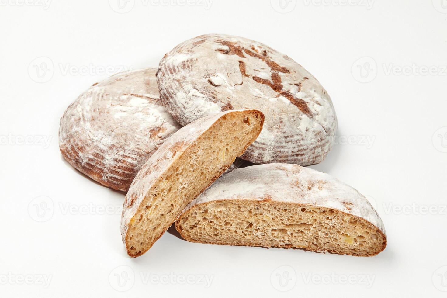 Artisan wheat bread loaves isolated on white background photo