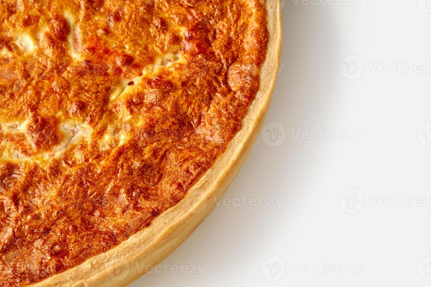 Closeup of browned quiche with cheese and salmon photo
