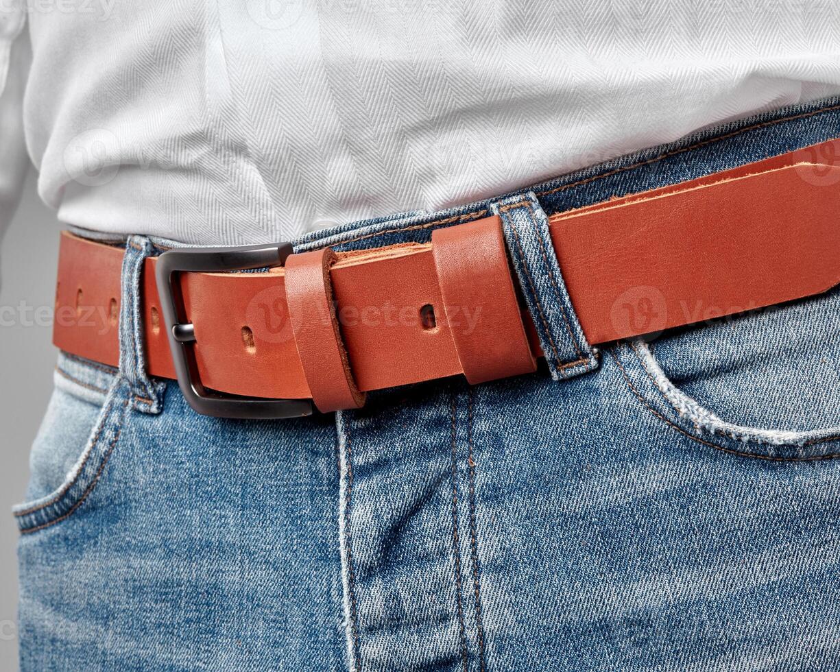 Man in casual attire with custom embossed terracotta leather belt photo