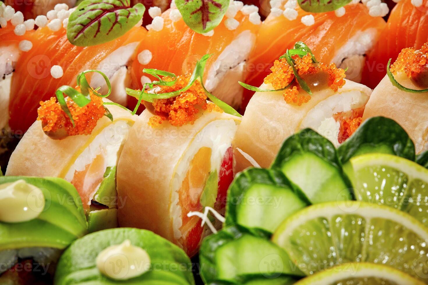 Vibrant assorted sushi rolls with salmon, avocado, mamenori, tobiko photo