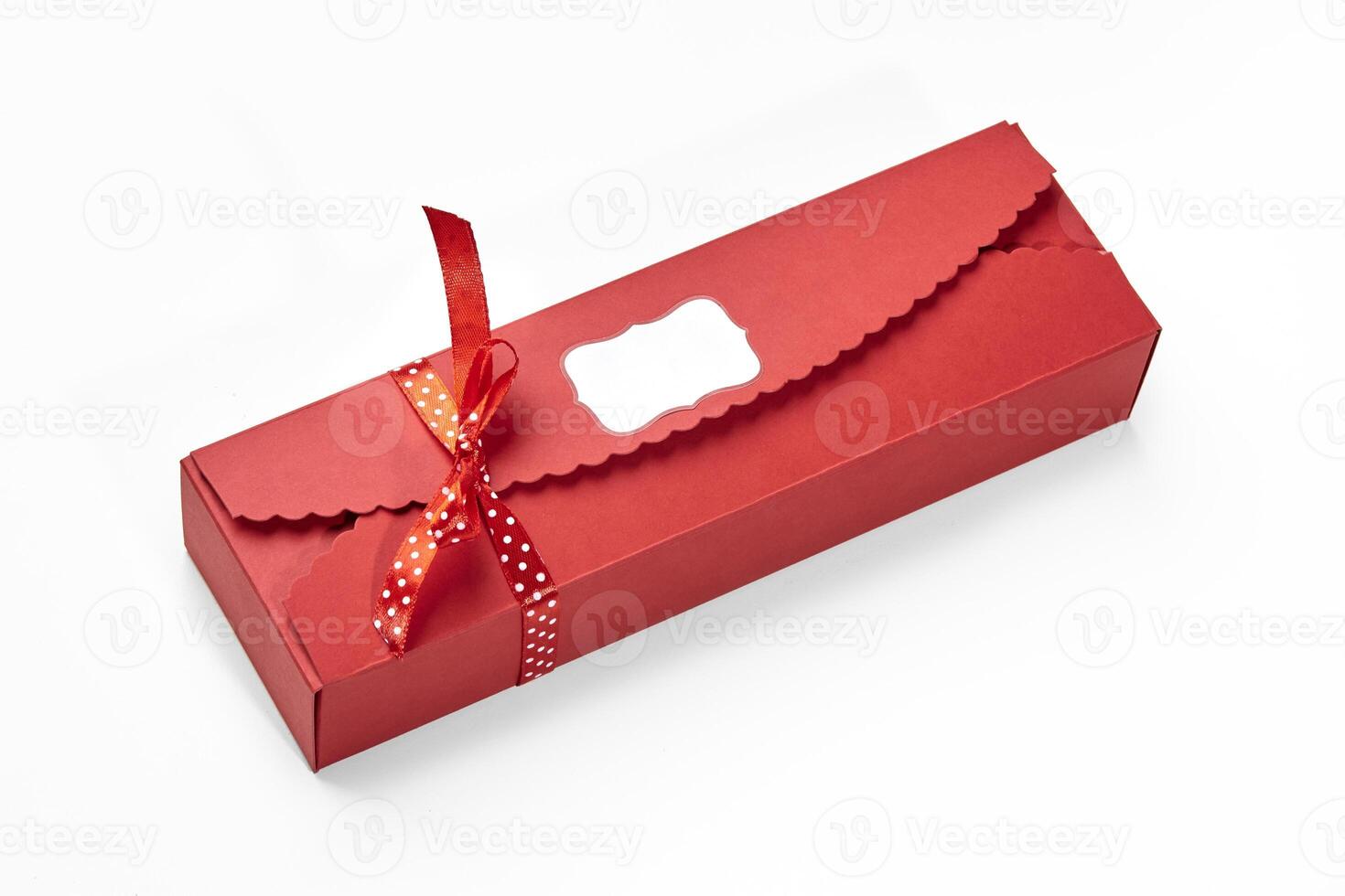 Elegant red box with polka dot ribbon for sweet gift photo