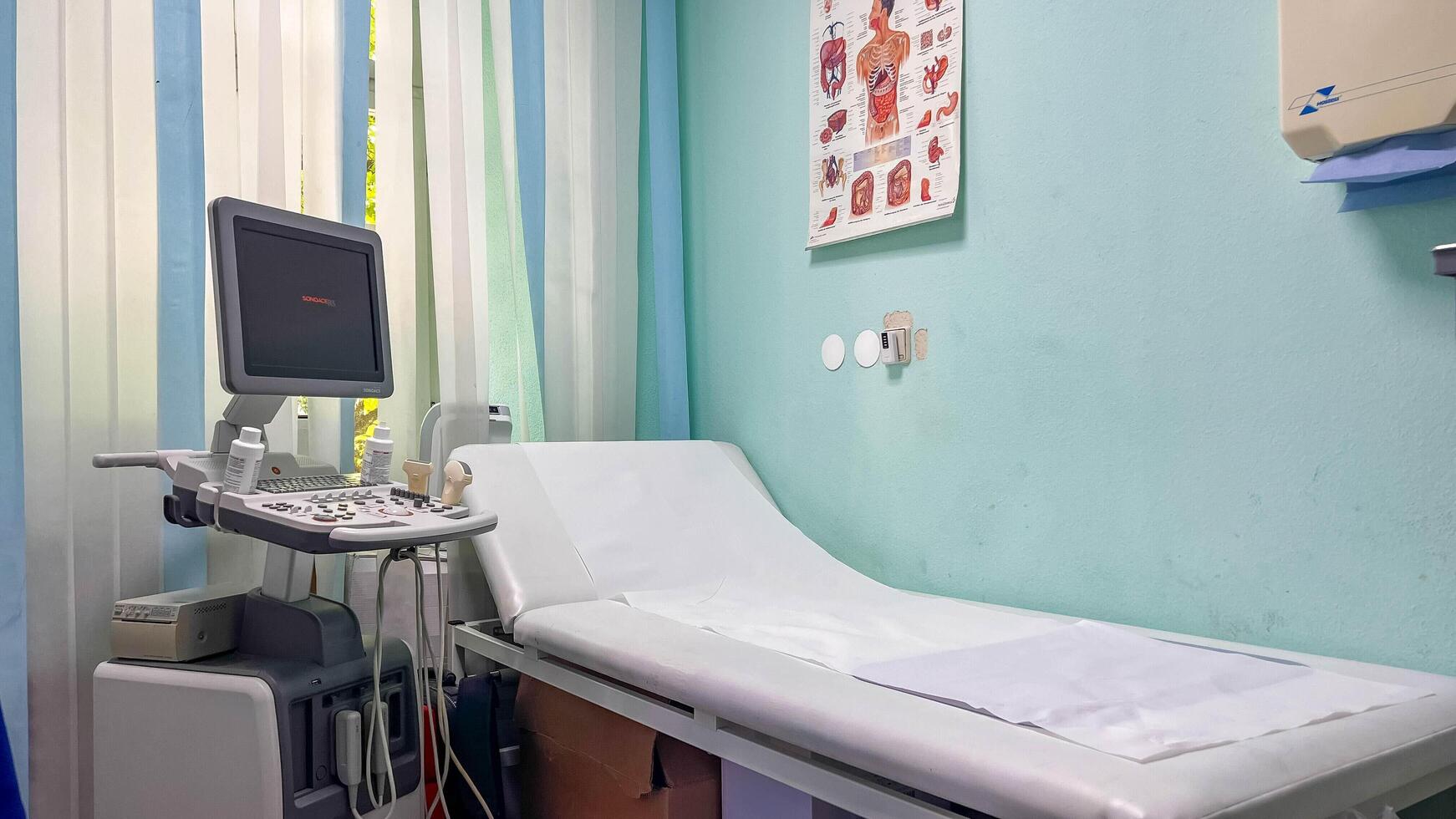 Germany, Schwabisch Gmund- May 28, 2024. Interior of medical room with ultrasound diagnostic equipment photo