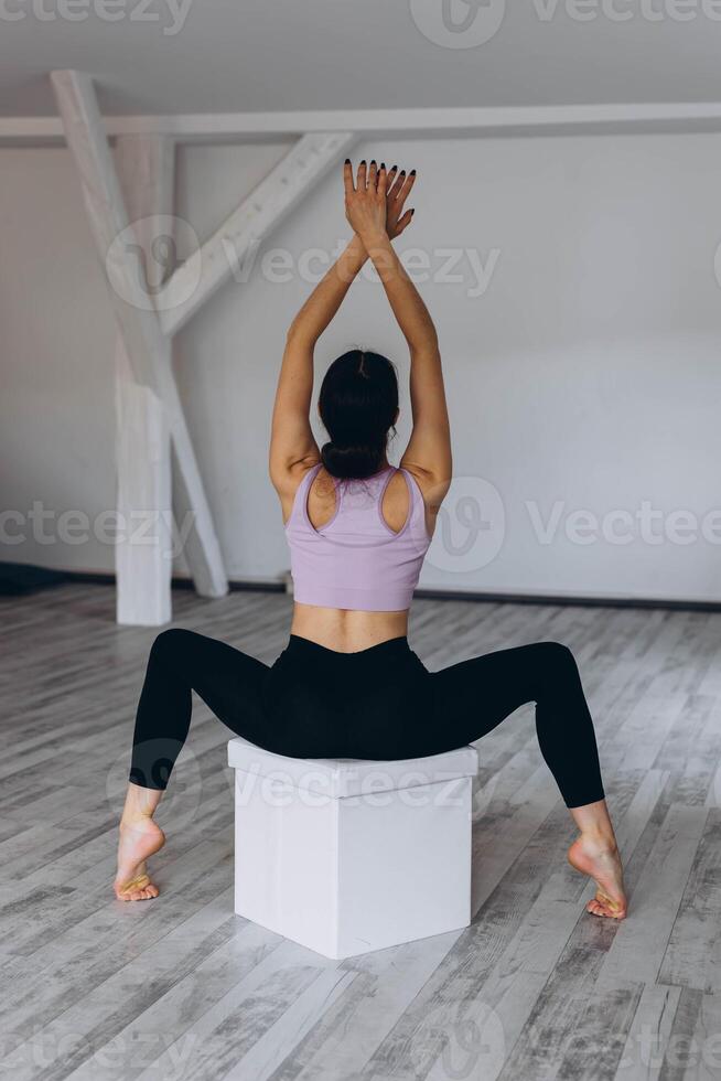 Sporty flexible girl doing stretching exercise photo