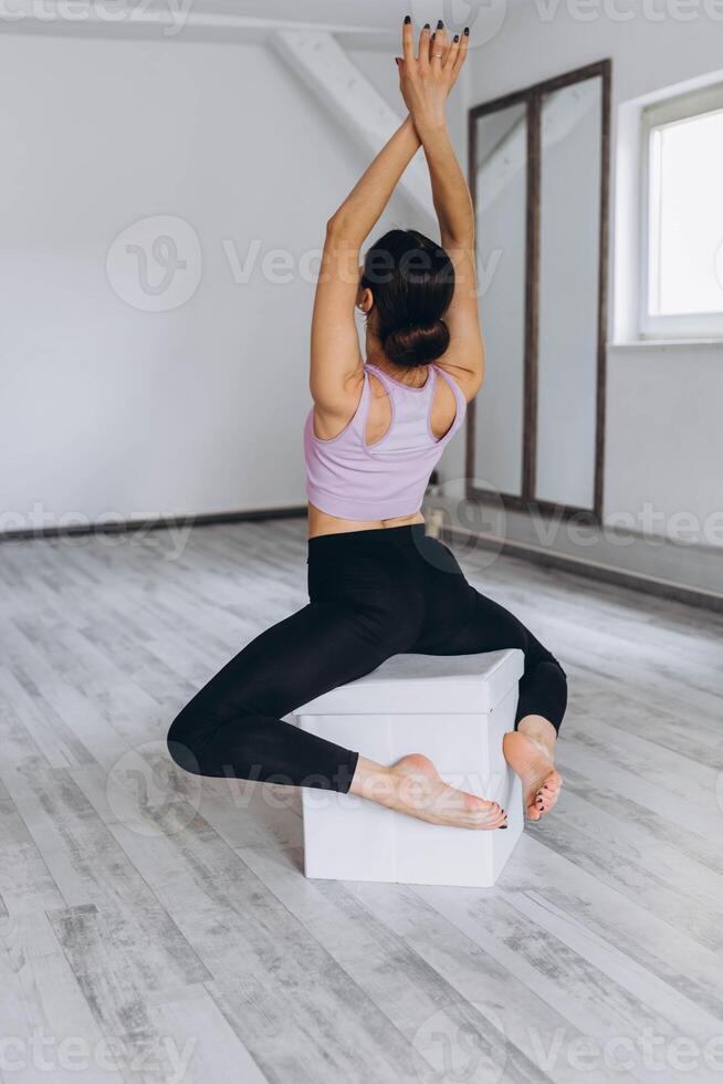 Sporty flexible girl doing stretching exercise photo