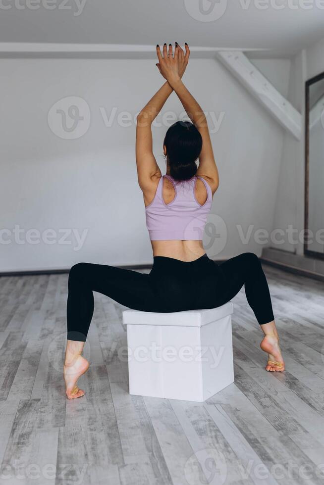 Sporty flexible girl doing stretching exercise photo