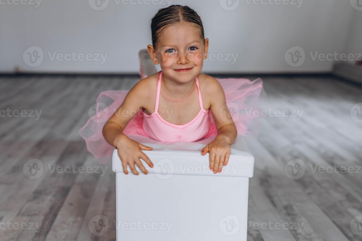 Baby ballet studio. Little ballerina with a coach in dance class. Ballet trainer for children photo