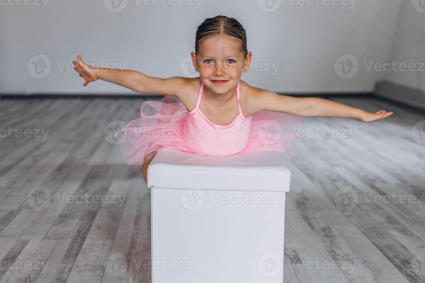 Baby ballet studio. Little ballerina with a coach in dance class. Ballet trainer for children photo