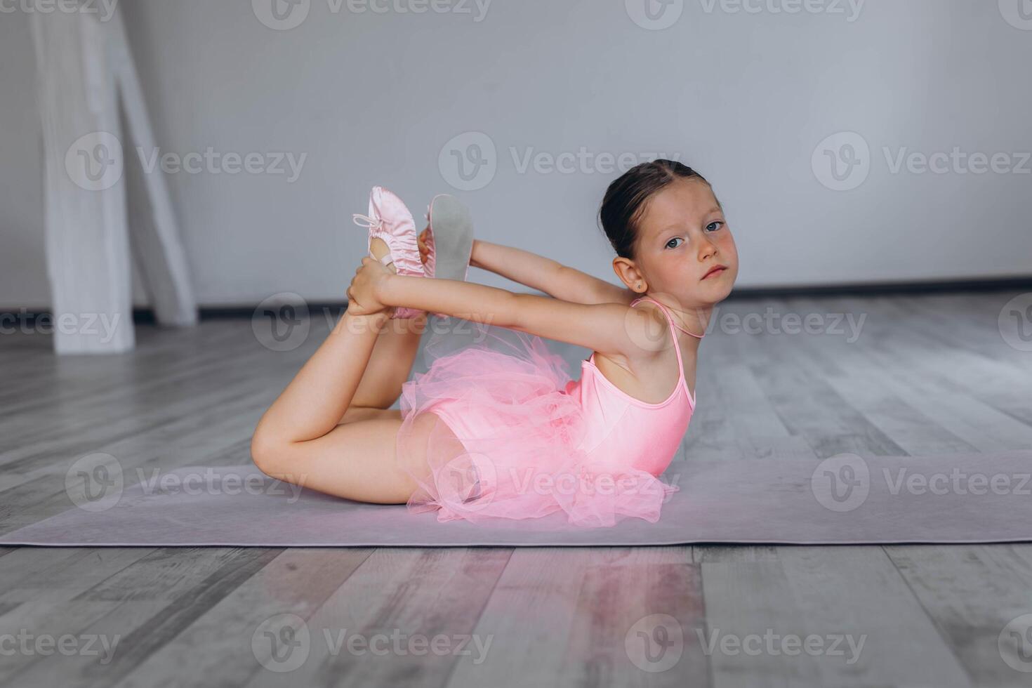 Baby ballet studio. Little ballerina with a coach in dance class. Ballet trainer for children photo