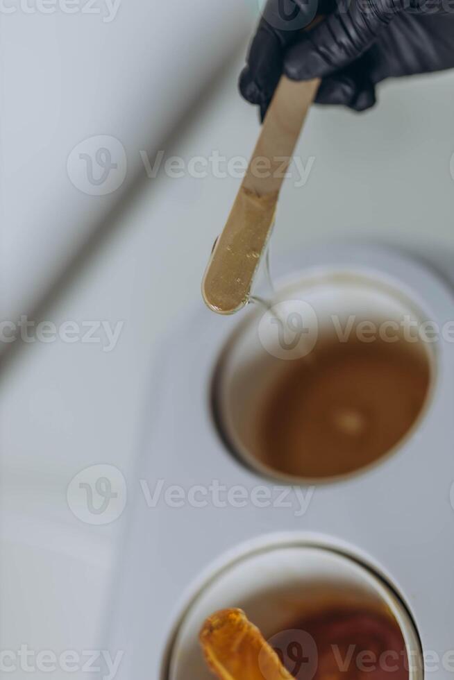 Sugar paste for shugaring depilation. Beauty spa minimalist concept. photo