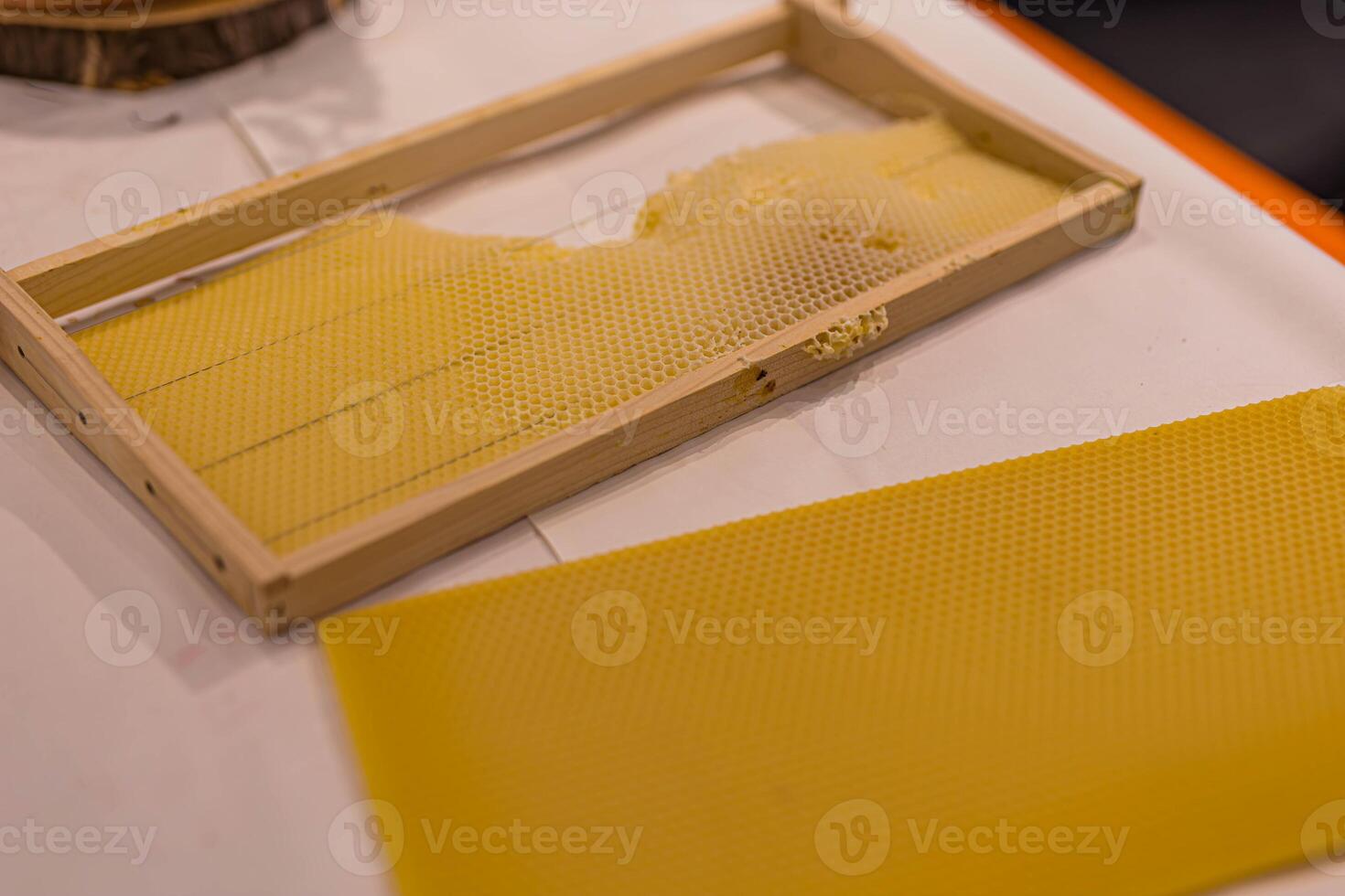 New frame with beehive wax isolated on white background photo