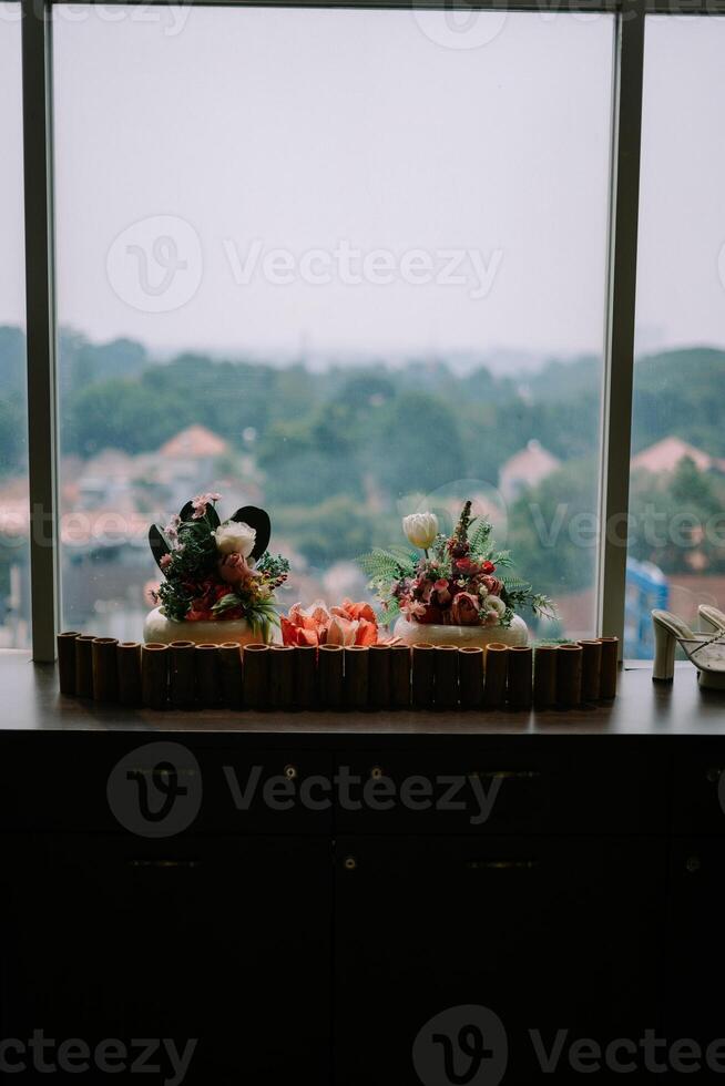 Exquisite floral centerpiece adorning a hotel table, adding a touch of elegance and freshness to the ambiance photo