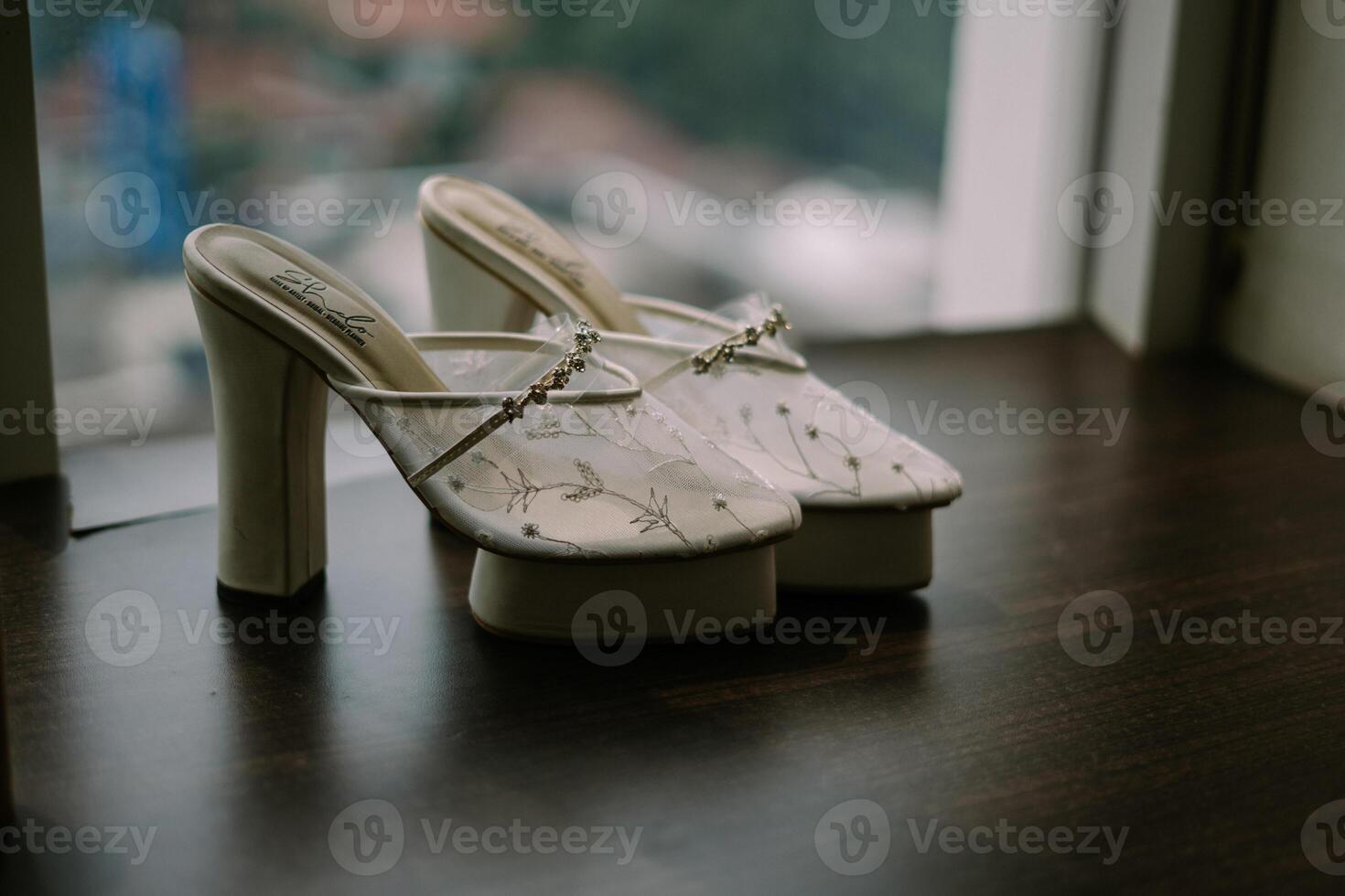 Elegant high-heeled wedding shoes, epitomizing style and sophistication. Ideal for showcasing bridal fashion and luxury accessories photo