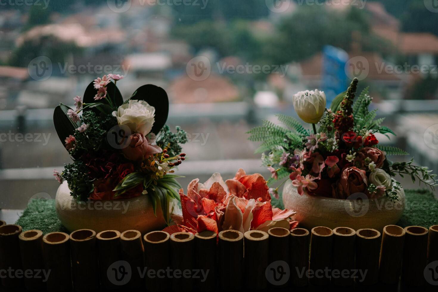 Exquisite floral centerpiece adorning a hotel table, adding a touch of elegance and freshness to the ambiance. photo