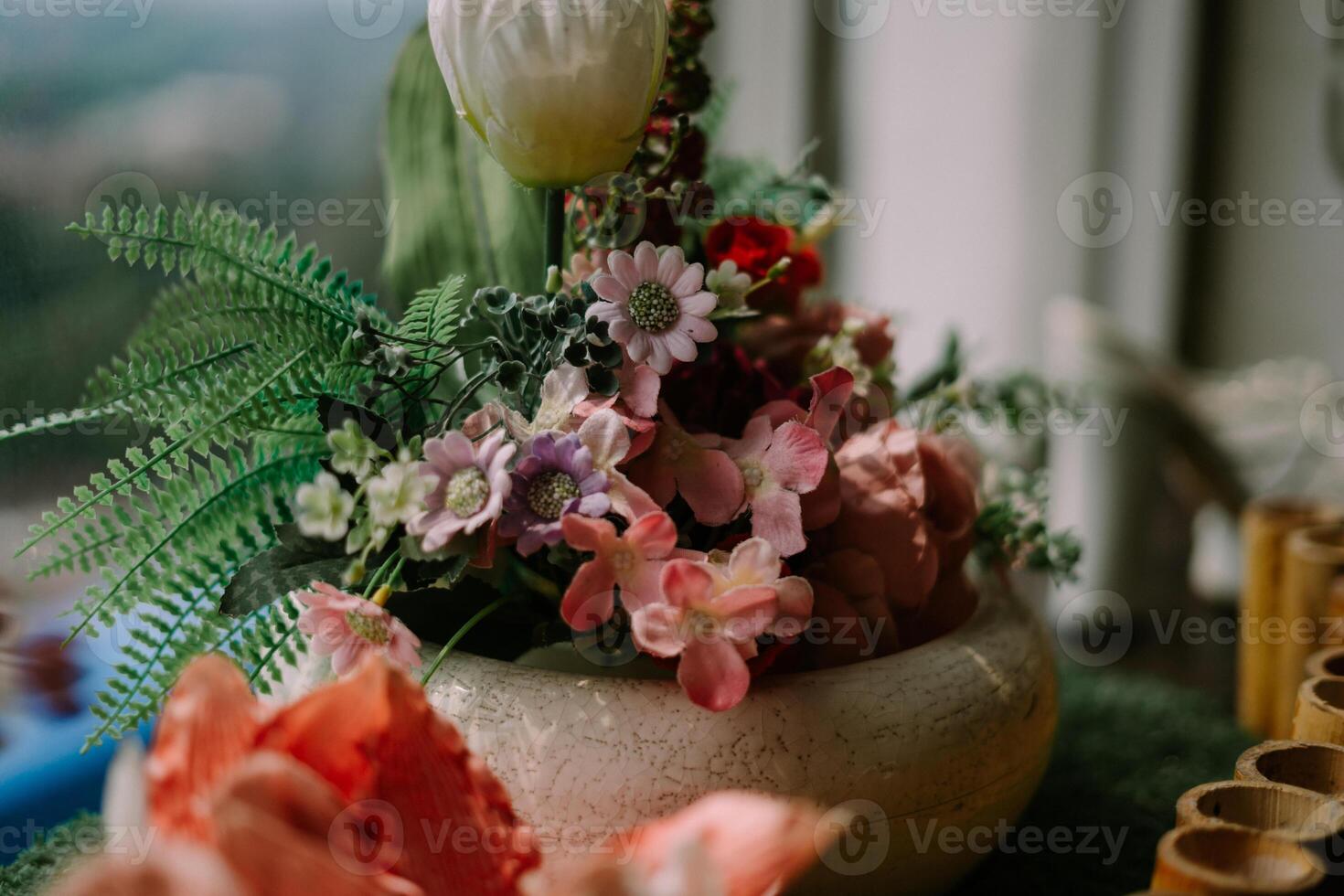 Exquisite floral centerpiece adorning a hotel table, adding a touch of elegance and freshness to the ambiance photo