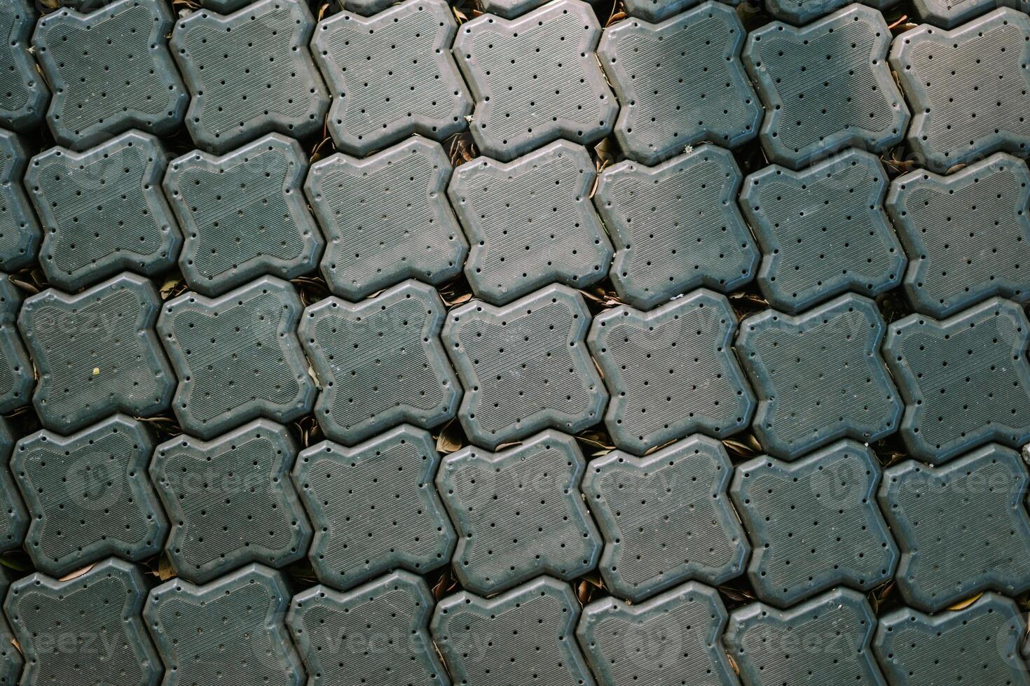 A pathway made of paving blocks crafted from recycled plastic waste, showcasing sustainable and eco-friendly urban design photo